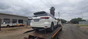 a white toyota fortuner moved by nyati